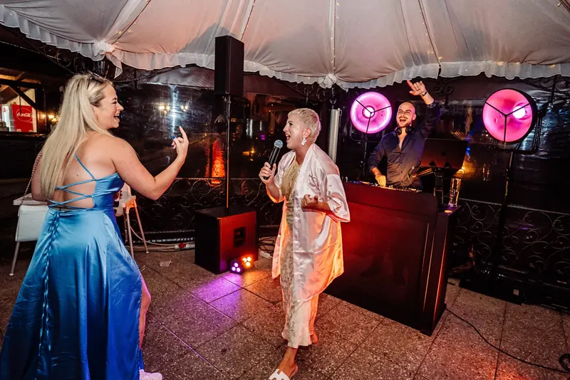 Guest singing on the mic at a private party